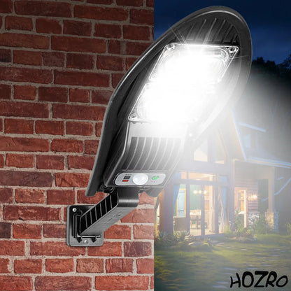 Lampă Solară HOZRO, de Exterior cu Telecomandă – Model W777B, 84 LED-uri SMD Ultra-Luminoase, Lumina Alb Rece, 3 Moduri de Funcționare, Senzor de Mișcare și Lumină, Unghi de Iluminare 120°, Material ABS Rezistent la Intemperii HOZRO
